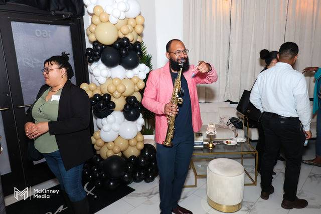 A guest performing at a Headshot Happy Hour