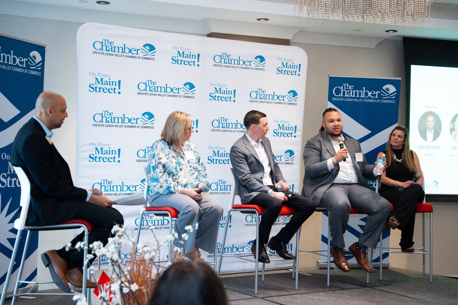 Panelists speak during a conference discussion