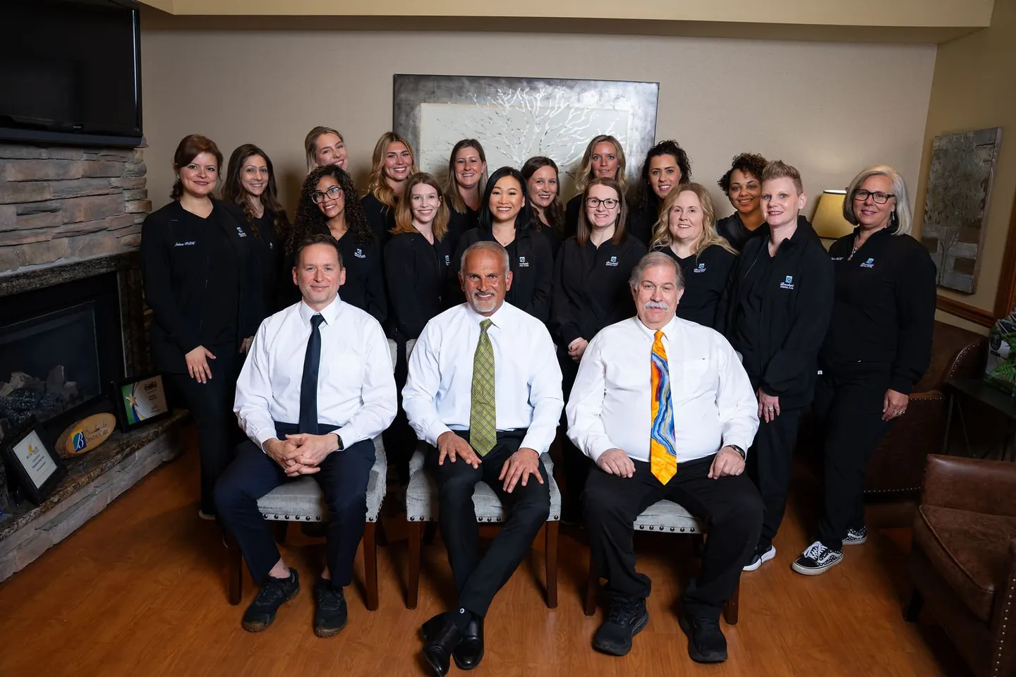 A team poses together for a group portrait